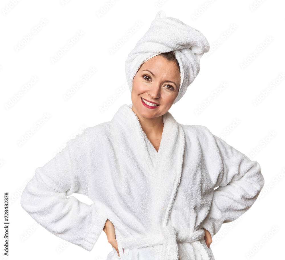 Caucasian woman in bathrobe and towel happy, smiling and cheerful. Caucasian woman in bathrobe and towel happy, smiling and cheerful.