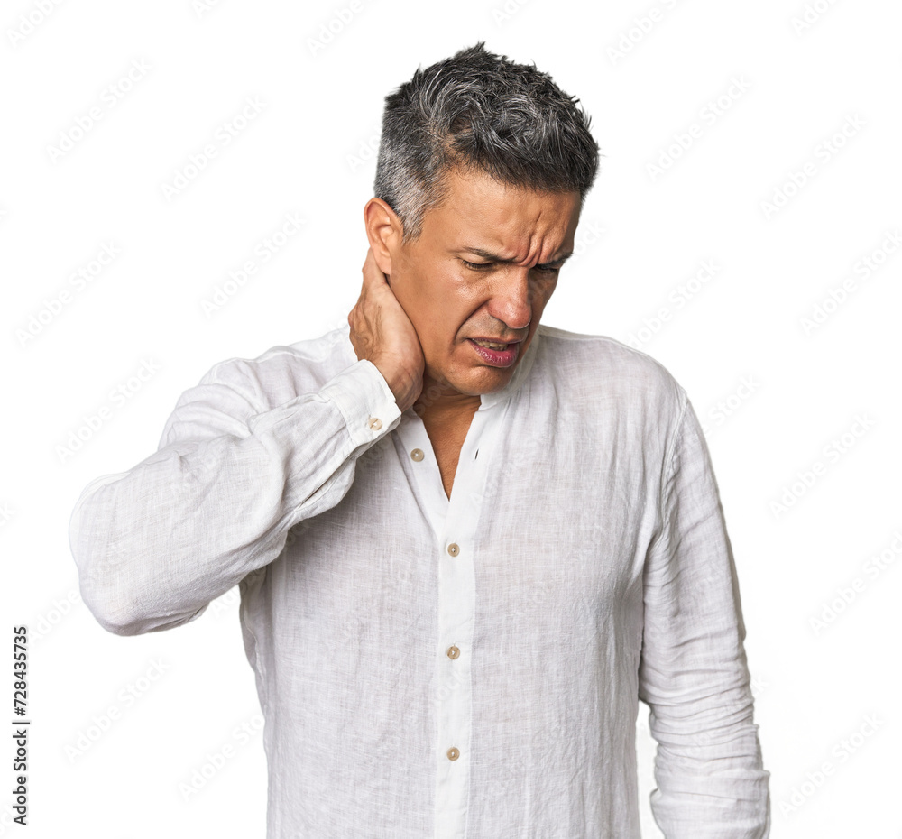 Middle-aged Latino man suffering neck pain due to sedentary lifestyle. Middle-aged Latino man suffering neck pain due to sedentary lifestyle.