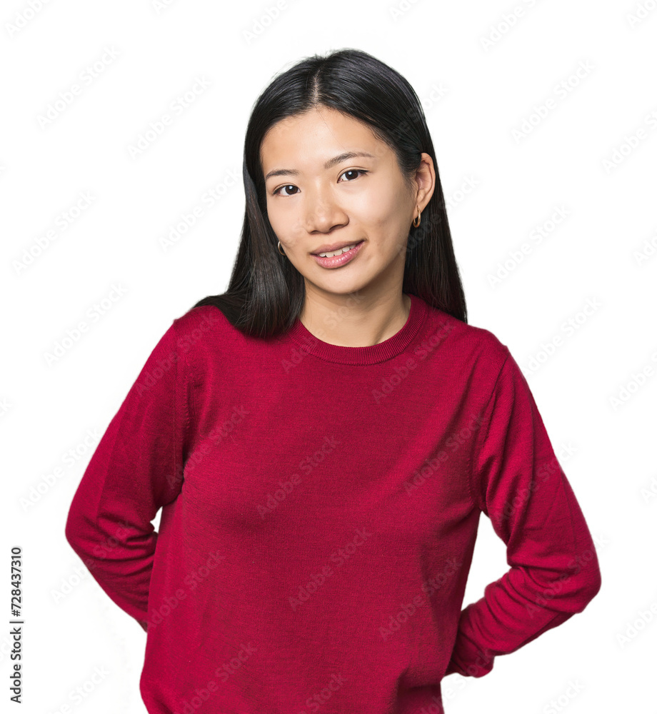 Young Chinese woman in studio setting happy, smiling and cheerful. Young Chinese woman in studio setting happy, smiling and cheerful.