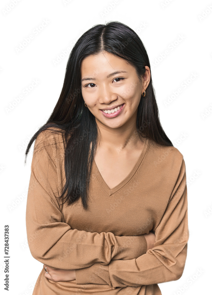 Young Chinese woman in studio setting laughing and having fun. Young Chinese woman in studio setting laughing and having fun.