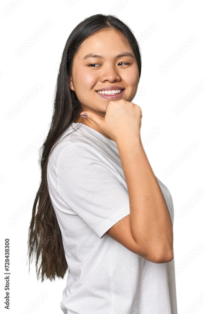Young chinese woman isolated points with thumb finger away, laughing and carefree. Young chinese woman isolated points with thumb finger away, laughing and carefree.