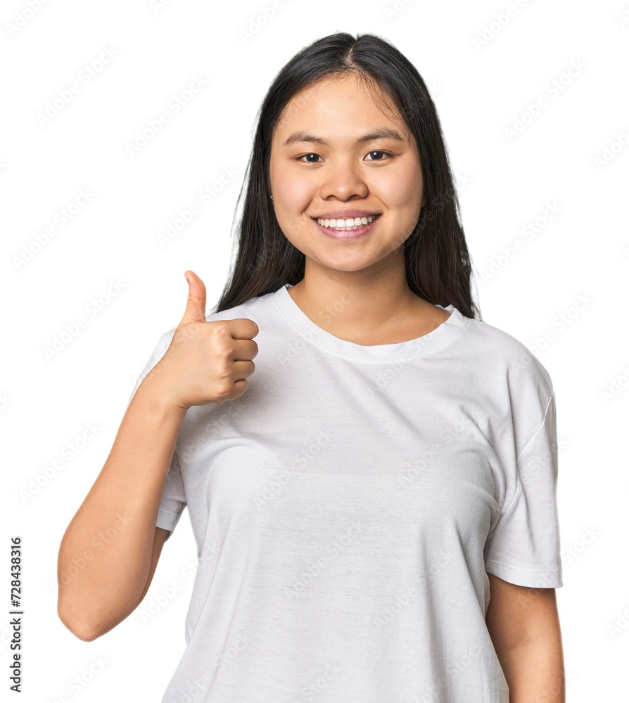 Young chinese woman isolated smiling and raising thumb up Young chinese woman isolated smiling and raising thumb up