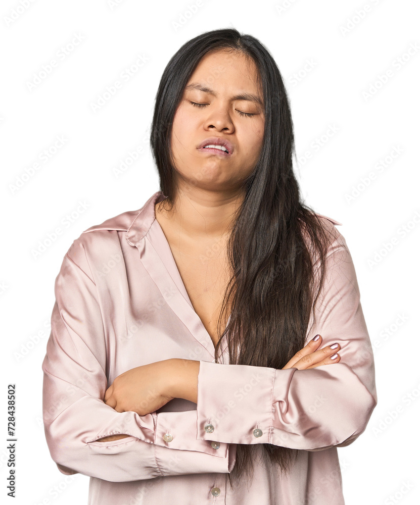 Young chinese woman isolated tired of a repetitive task. Young chinese woman isolated tired of a repetitive task.