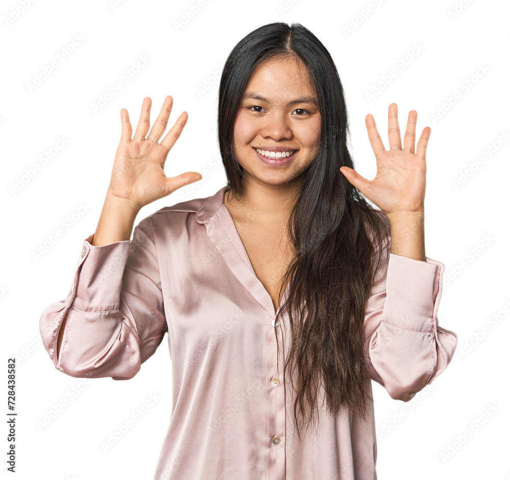 Young chinese woman isolated showing number ten with hands. Young chinese woman isolated showing number ten with hands.