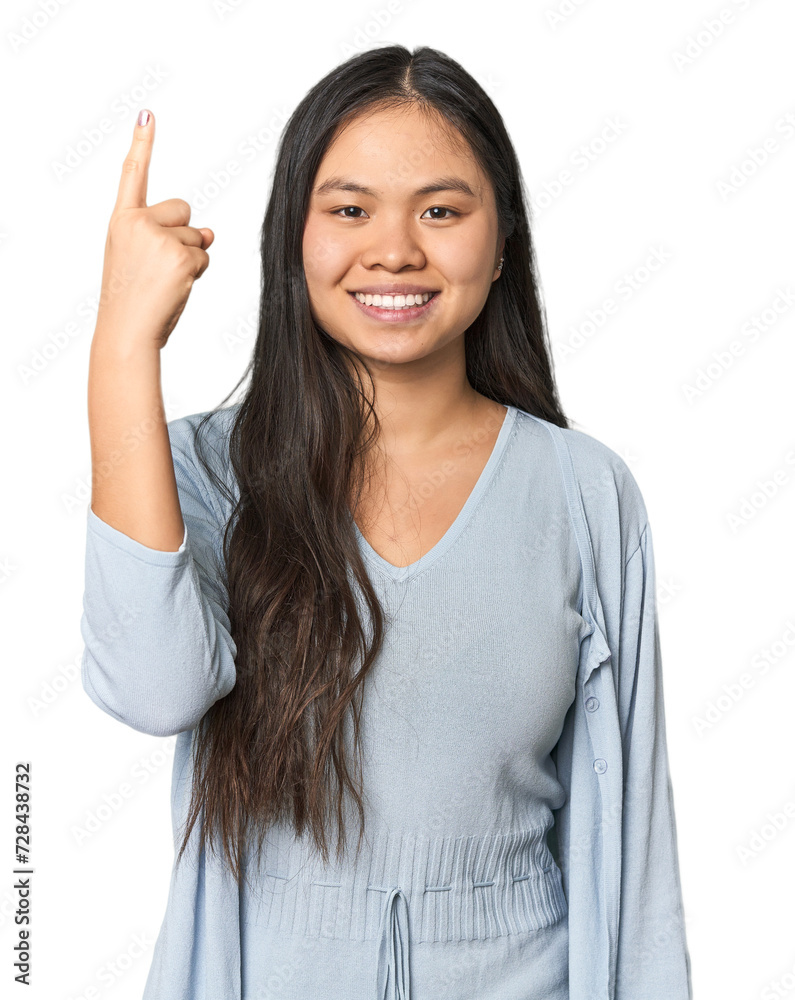 Young chinese woman isolated showing number one with finger. Young chinese woman isolated showing number one with finger.