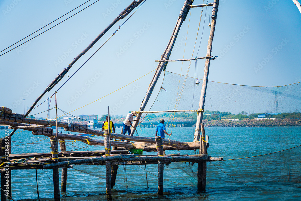 Fishermen working, Fort Kochi Kerala near Arabian Sea Fishermen working, Fort Kochi Kerala near Arabian Sea