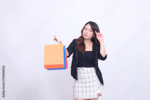 beautiful female customer asian 20s formal office cheerful get discount shopping tote paper bag aside hand gesture thinking up isolated white background