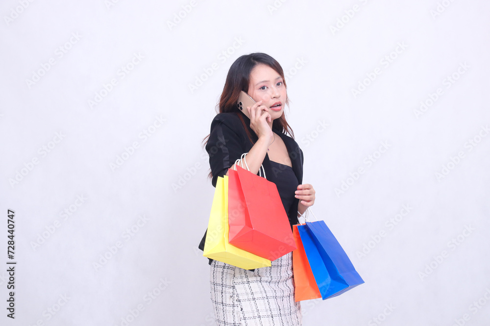 customer beautiful girl asian 20s formal office shocked relaxed left sided phone carrying paper bag shopping isolated white background customer beautiful girl asian 20s formal office shocked relaxed left sided phone carrying paper bag shopping isolated white background