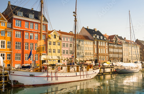 Colourful houses in Nyhavn, one of Copenhagen’s most iconic sights for travelers. Also neighborhood of famous Danish fairy tales writer Hans Christian Andersen.