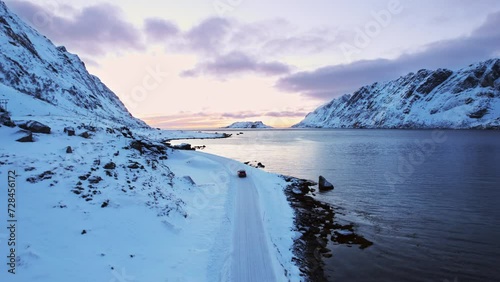 Coastal road along  Agvatnet Lake during Winter snow photo