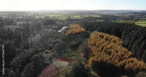 Aerial View Of Woodland Forest Located In Blackdown Hills Area of Outstanding Natural Beauty south of Otterford in Somerset. Pull Back Shot photo