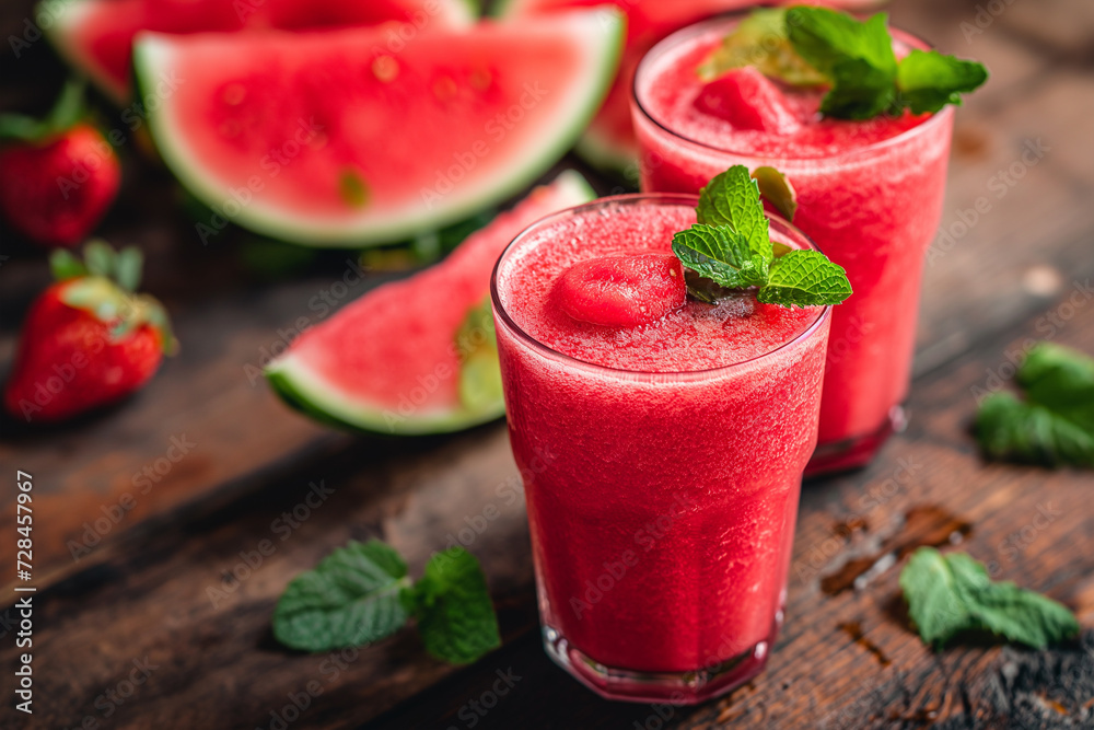 Watermelon cocktail on a wooden table. Watermelon cocktail on a wooden table.