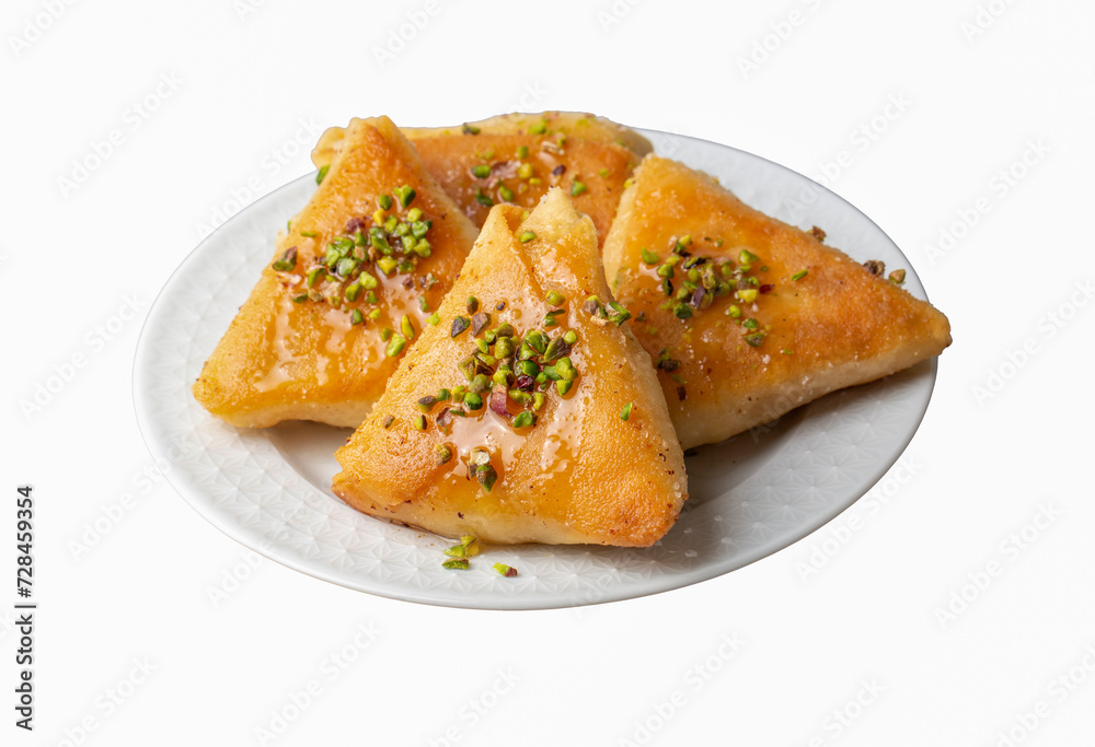 Traditional Turkish desserts; custard triangular dessert, albanian dessert ( Turkish name; Arnavut tatlisi or muhallebili muska tatlisi) Traditional Turkish desserts; custard triangular dessert, albanian dessert ( Turkish name; Arnavut tatlisi or muhallebili muska tatlisi)