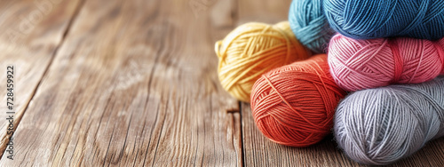 colored threads for knitting on a red background photo