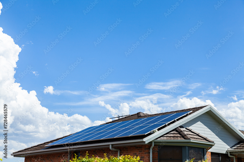 Roof filled with solar panels and big blue sky with copy space Roof filled with solar panels and big blue sky with copy space