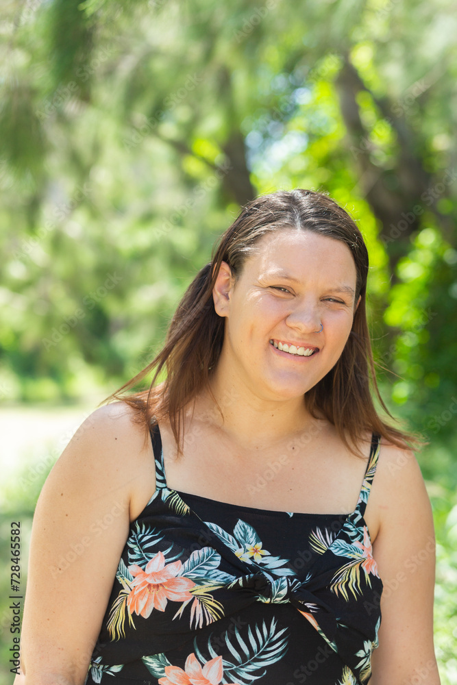 Portrait of a happy woman grinning outside in summer Portrait of a happy woman grinning outside in summer