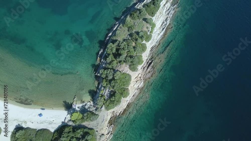 Overhead 4K drone clip over a rock formation in the tropical blue waters of Toroni in Chalkidiki photo