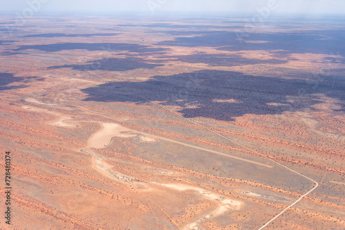 Fototapeta Naklejka Na Ścianę i Meble -  little airfield with sand runway and dune stripes of Kalahari,  Pokweni, Namibia