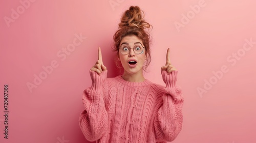 Portrait image of a young woman showing her finger up © igustiayusiska