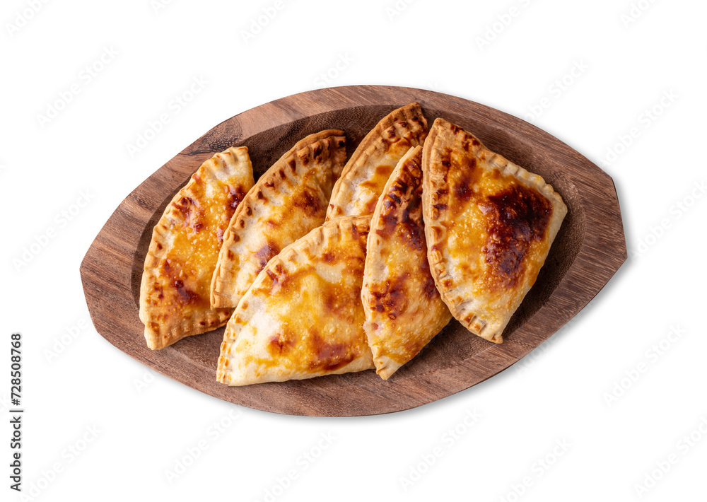 Typical brazilian snack baked pastel on a plate isolated over white background Typical brazilian snack baked pastel on a plate isolated over white background