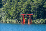A“red gate of peace” (heiwa no torii) in Hakone-jinja shrine standing proud and tall in Ashinoko Lake, Kanagawa prefecture, Japan 