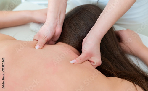 Massaging the neck of a woman