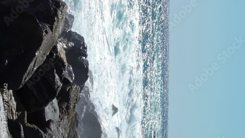 Huge waves break on the coastal cliffs of the Italian Riviera photo
