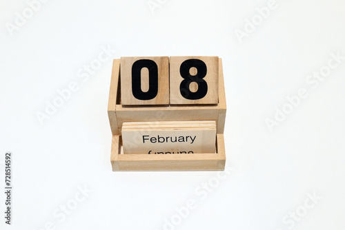 8th of February wooden perpetual calendar. Shot close up isolated on a white background 