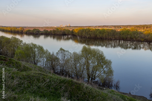 View of the factory near the river  rural landscape  near the industrial zone.