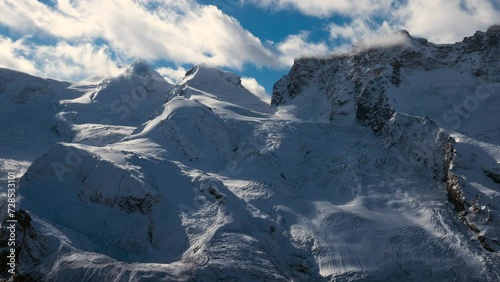 Timelapse glacier paradise Zermatt Matterhorn Switzerland The Gornergrat Swiss alps autumn winter Christmas fresh white first snow blue sky late morning noon cloudy stunning dramatic landscape photo