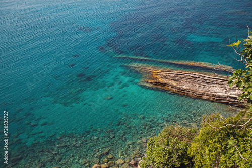 Wallpaper Mural seaside. texture of the sea coast. The sea view, the rocks on the beach with turquoise sea water. Liguria , Italy. Torontodigital.ca