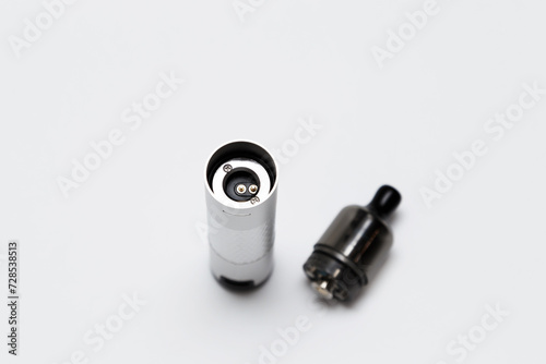 Opened vaping device, vape, pod, kit silver color on white background, top view