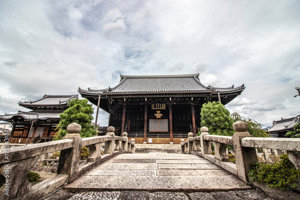 Magnificent ancient temple in Kyoto, Japan. Asian religious architecture and iconic Japanese temple in this image with cloudy sky. Horizontal image