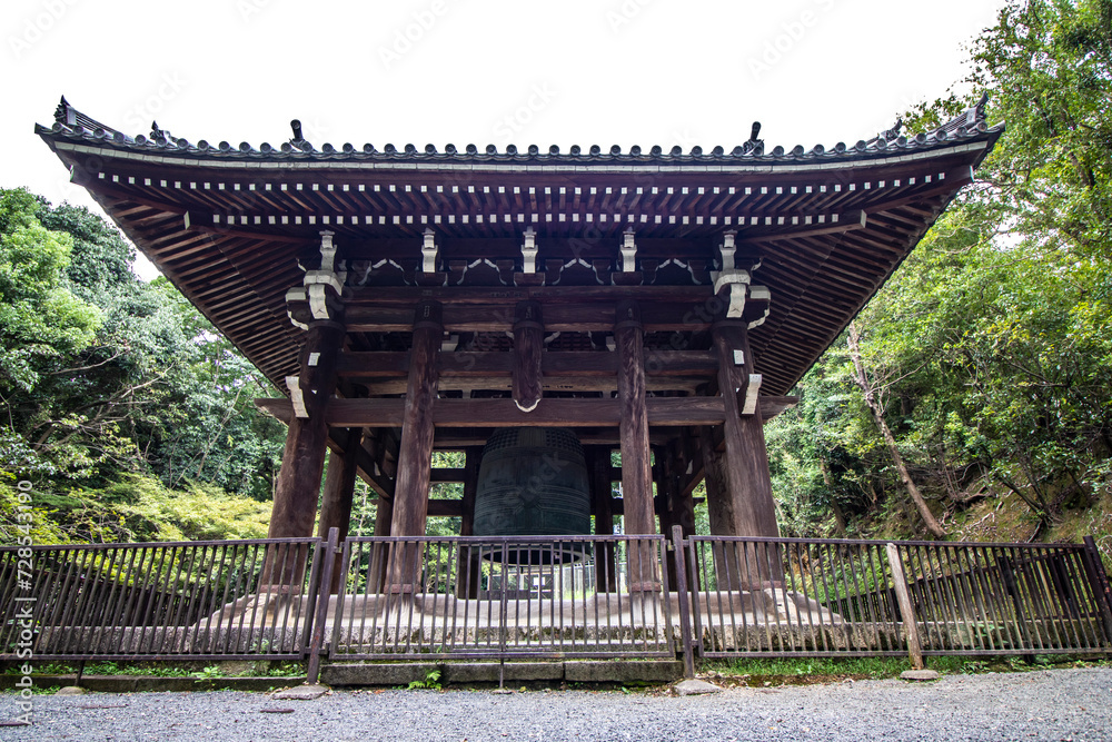Obraz premium Perfect framing Close-up view from below an ancient Japanese temple in Kyoto, Japan, mature tree and zen garden, horizontal image