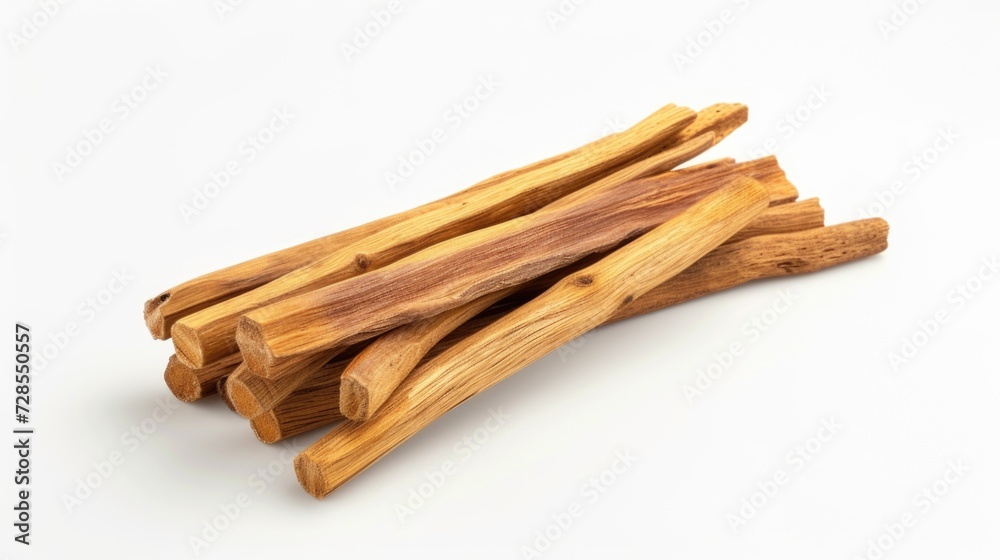 A pile of wood sticks on a white surface. Perfect for backgrounds or DIY projects