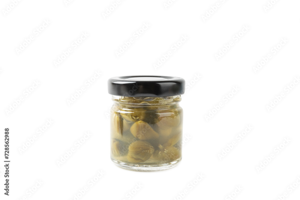 Capers in a glass jar isolated on a white background. Marinated caper buds, small salted capparis in bowl, fermented food, pickled capers group.Organic spices and seasonings. Capers in a glass jar isolated on a white background. Marinated caper buds, small salted capparis in bowl, fermented food, pickled capers group.Organic spices and seasonings.