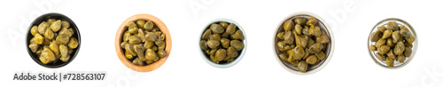 Capers in a bowl isolated on a white background. Marinated caper buds, small salted capparis in bowl, fermented food, pickled capers group.Organic spices and seasonings. photo