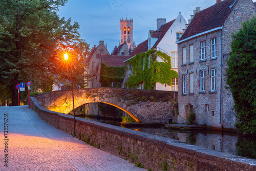 Scenic night cityscape with a medieval tower Belfort and the Green canal, Groenerei, in Bruges, Belgium