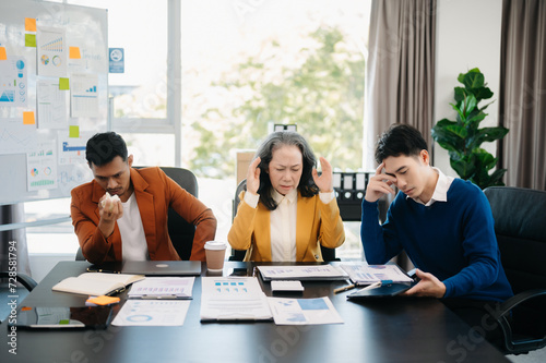 Team thinking of problem solution Furious two Asian businesspeople arguing strongly after making a mistake at work