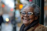 Smiling Older Woman With Glasses on a City Street
