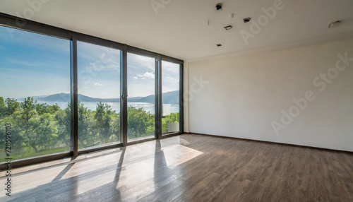 Empty modern room with white walls and large windows Minimalist interior design in a luxury apartment The space is clean and contemporary