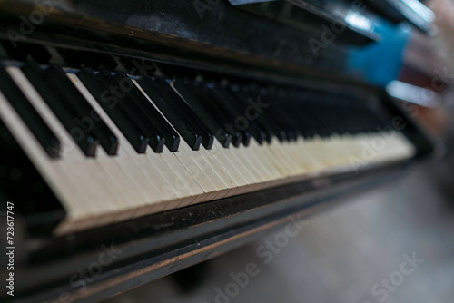 dusty old piano keyboard © tino