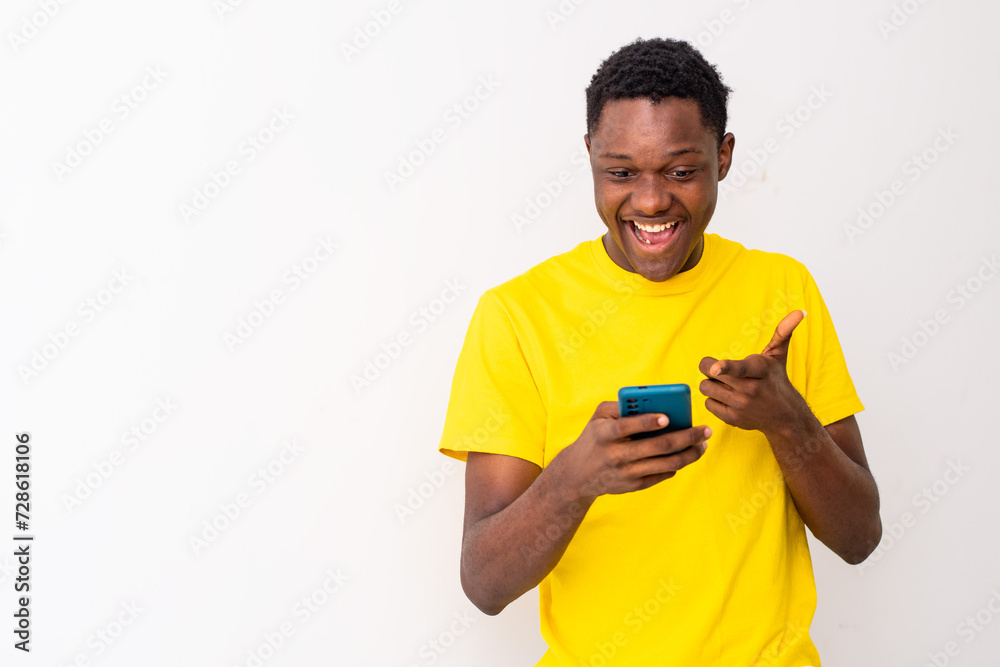 excited young black man checking his smartphone excited young black man checking his smartphone