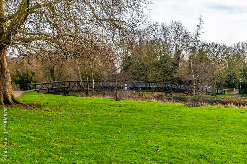 A view towards the Royal Engineers Bridge on the River Great Ouse in Bedford, UK on a bright sunny day A view towards the Royal Engineers Bridge on the River Great Ouse in Bedford, UK on a bright sunny day