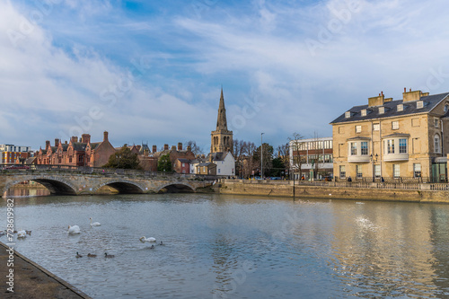 A view from the southern shore across the River Great Ouse towards the centre of Bedford, UK on a bright sunny day