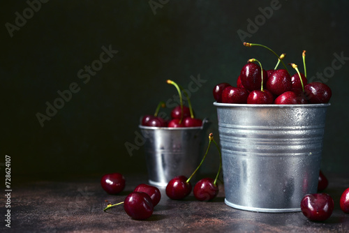 Fresh ripe organic cherry in a metal bucket. photo