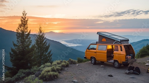 Solitary retro yellow camper van parked on a serene mountain peak at twilight.