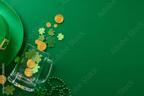 Irish jig jubilee: St. Patrick's Day bash bonanza. Top view photo of leprechaun hat, blank pint, trefoils, coins, beads on green background with greeting space
