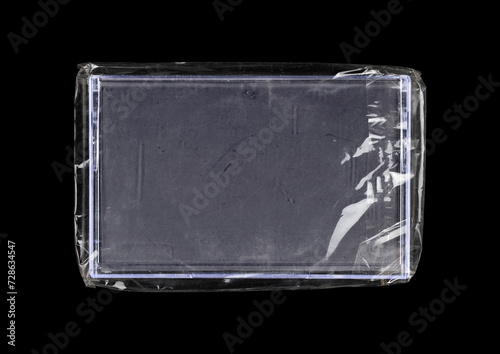 Old cassette tape case on black background. Isolated music transparent mockup. Clean cover box template.