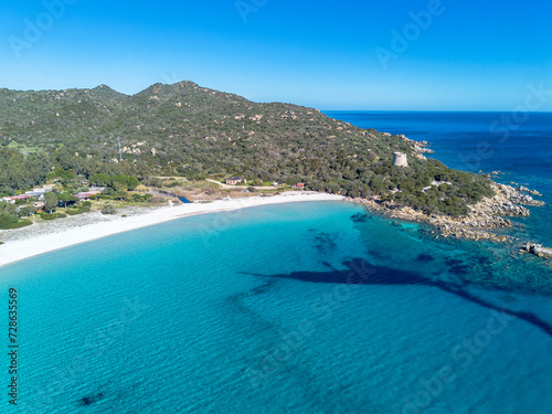 Cala Pira beach and tower, with white sand and crystal clear water seen from above with drone. Castiadas, Sardinia, Italy photo